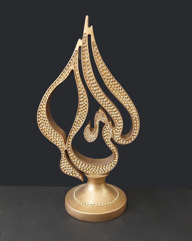 Coppia di statue color oro con strass