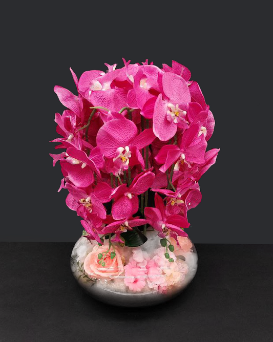 Bouquet fiori artificiali rosa con vaso trasparente e fiori assortiti